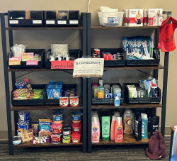 shelves stocked with items like food, bathroom products, and more