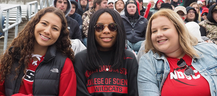 students at homecoming football game