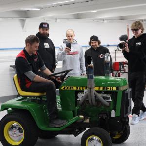 CboysTV group looking at lawn mower