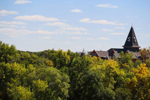 Old Main peak surrounded by trees